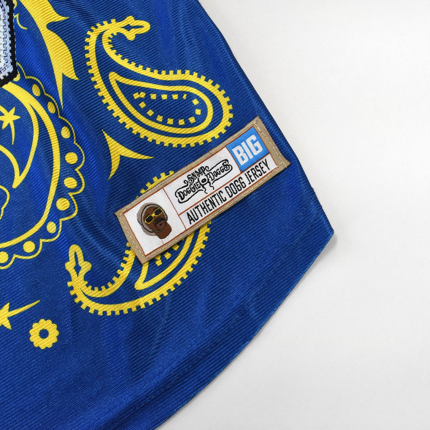 A close up detail image showing design sublimation and embroidered jersey tag of the Halftime Deluxe Pet Jersey.