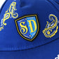 A close up detail image showing the SD Micro Mold Patch and paisley designs on the Halftime Deluxe Pet Baseball Hat.