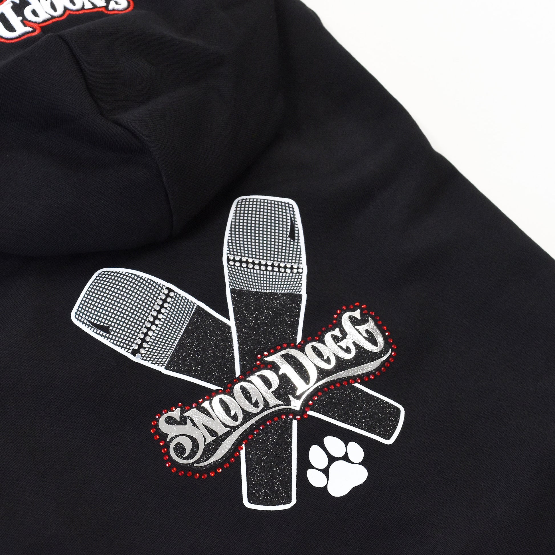 A close up of the Mic Drop Deluxe Pet Hoodie sparkle design.