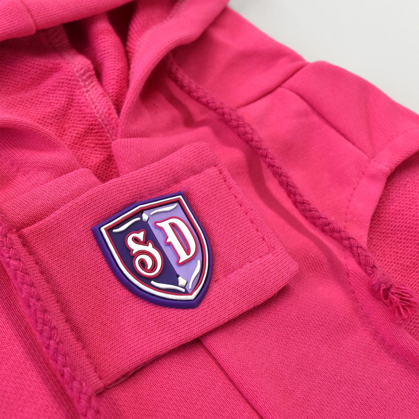 A close up detail image of the SD Micro Mold and Velcro strap on the Boss Lady Deluxe Pet Hoodie.