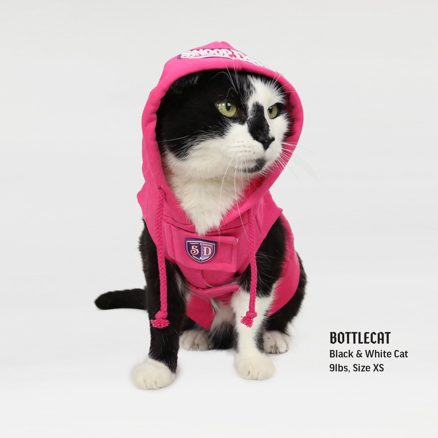 Bottlecat the Black and White Cat wearing the Boss Lady Deluxe Pet Hoodie in size Extra Small.