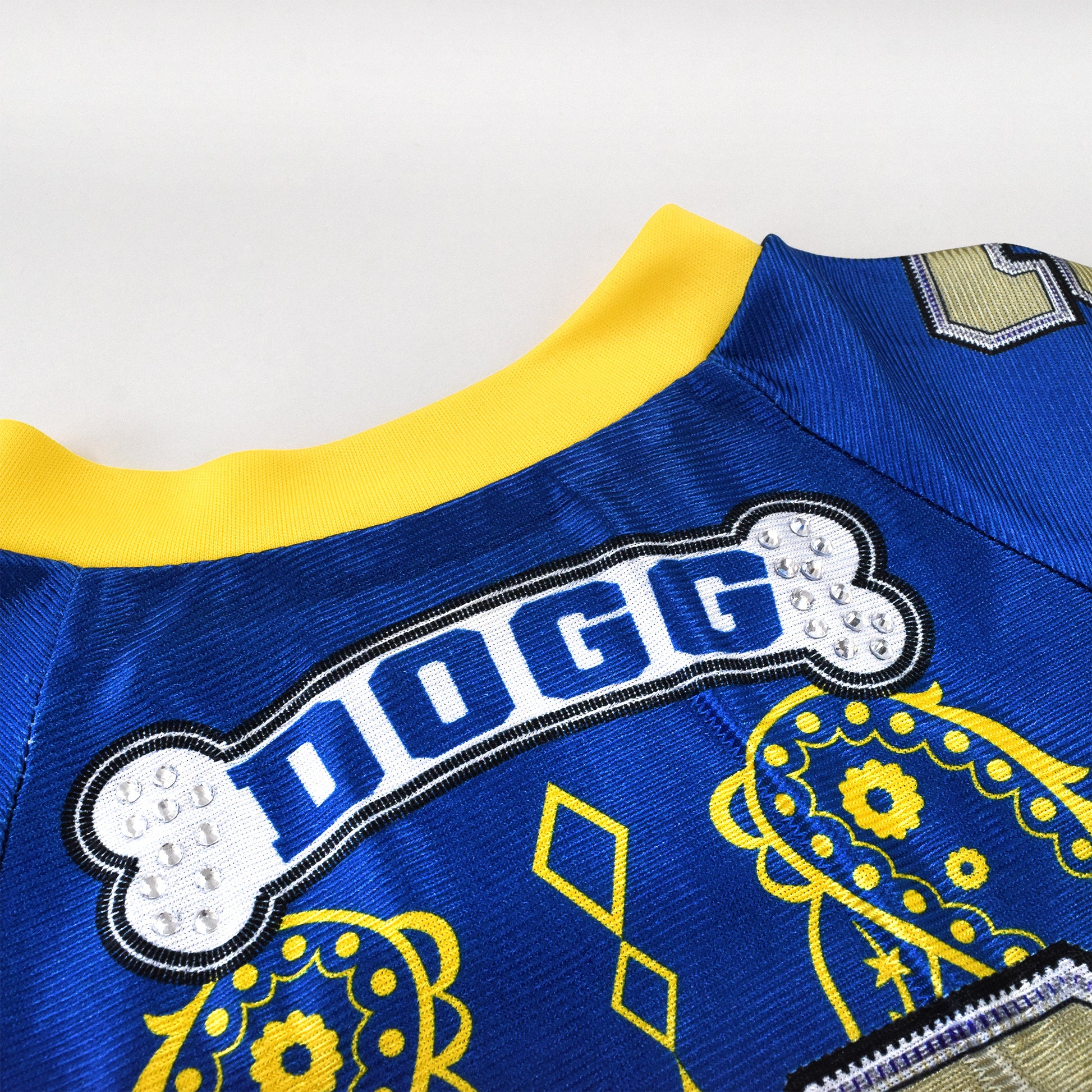 A close up detail image showing design sublimation and sparkle detail of the Halftime Deluxe Pet Jersey.