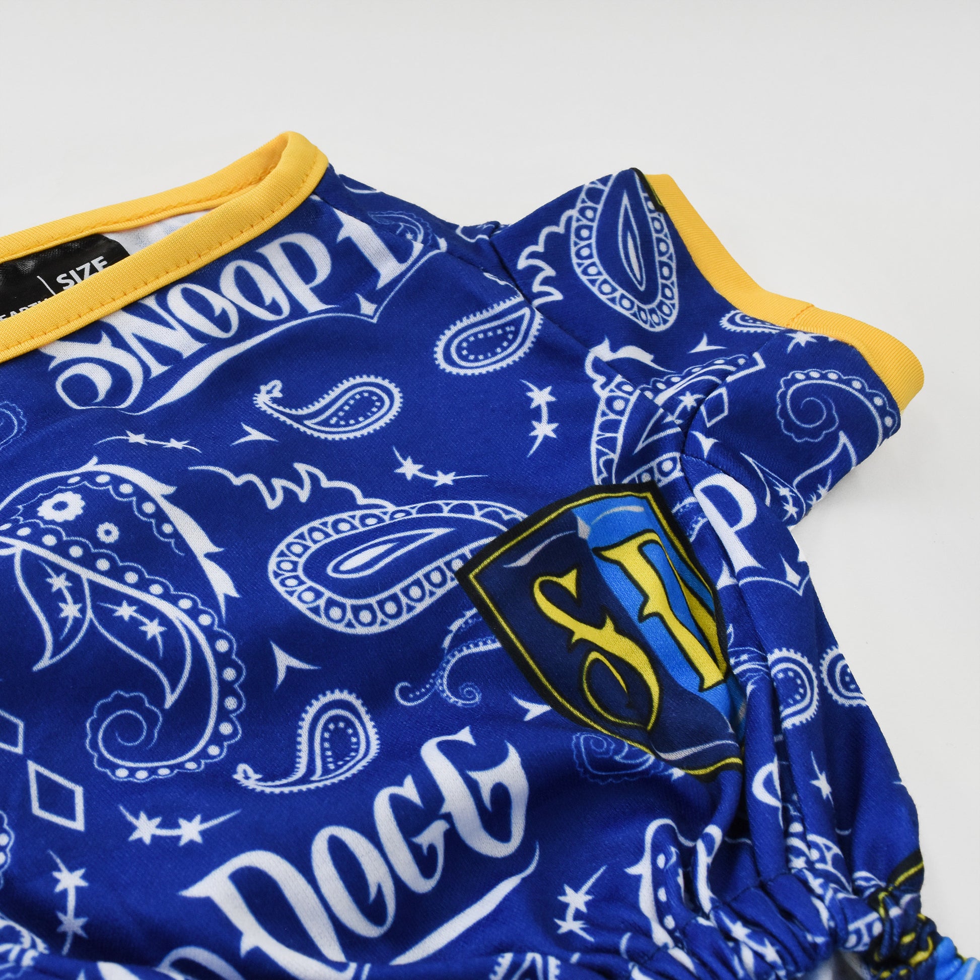 A close up of the Halftime Deluxe Pet PJs sublimated design and gold trim.