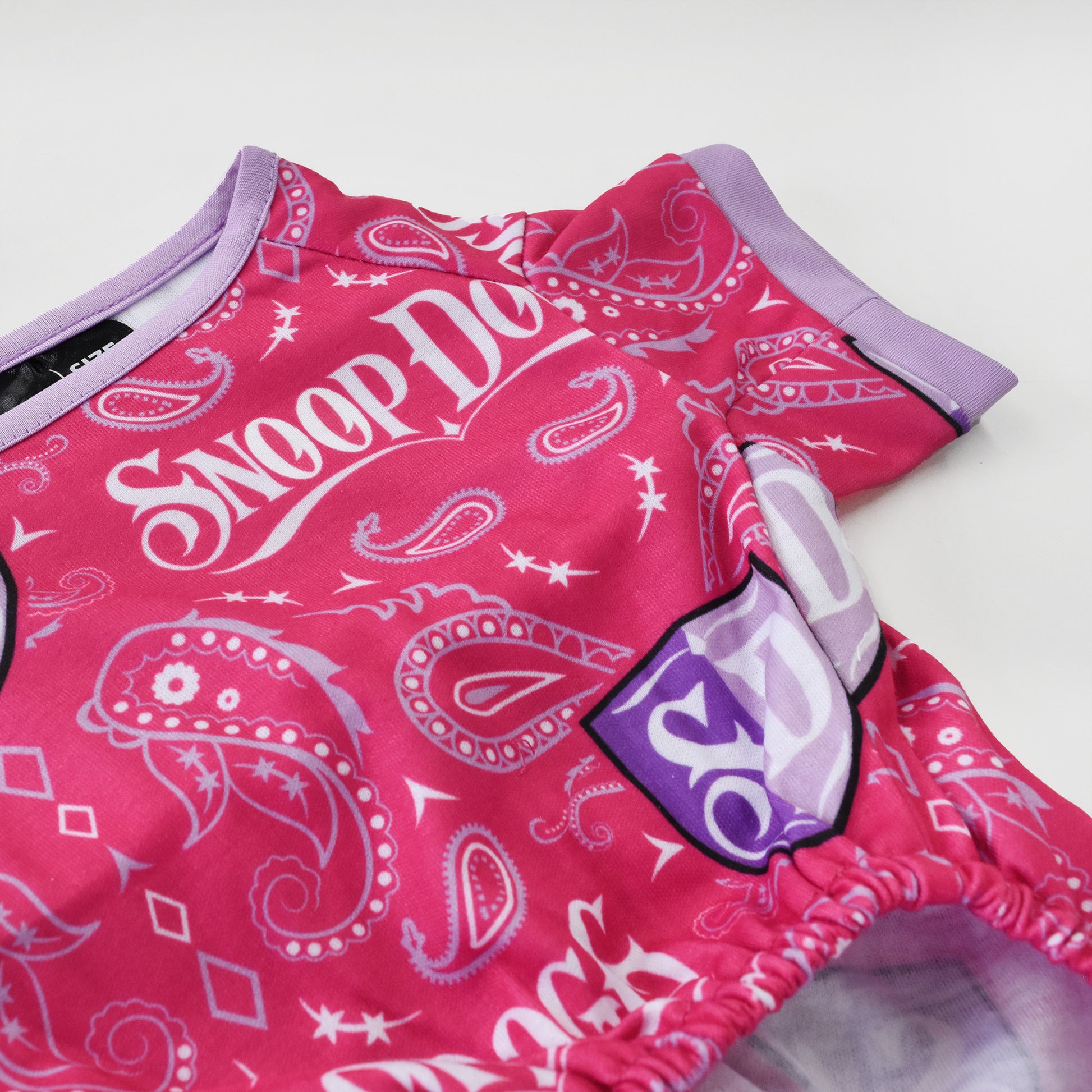 A close up of the Boss Lady Deluxe Pet PJs sublimated design and lavender trim.