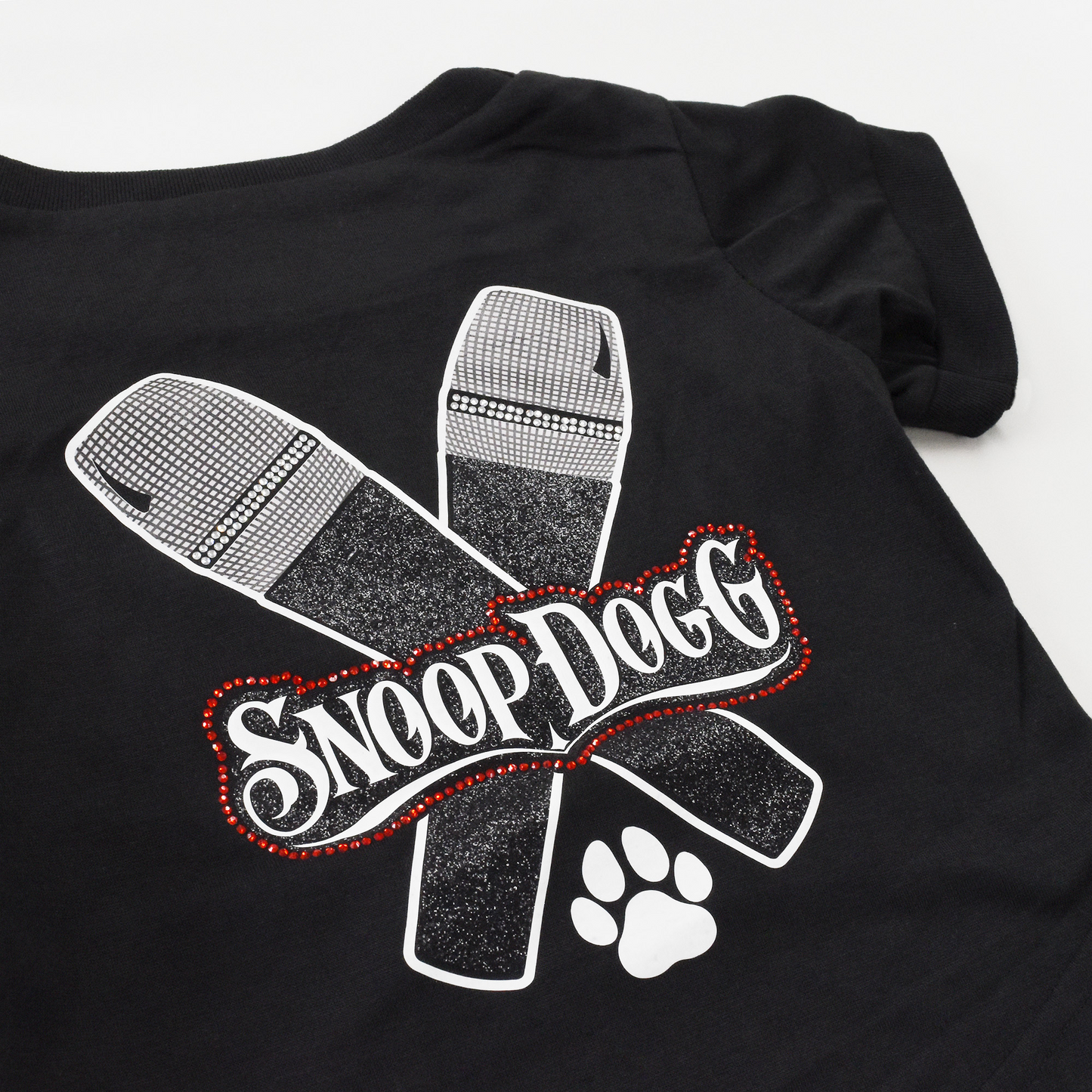 A close up of the Mic Drop Deluxe Pet T-Shirt sparkle design.