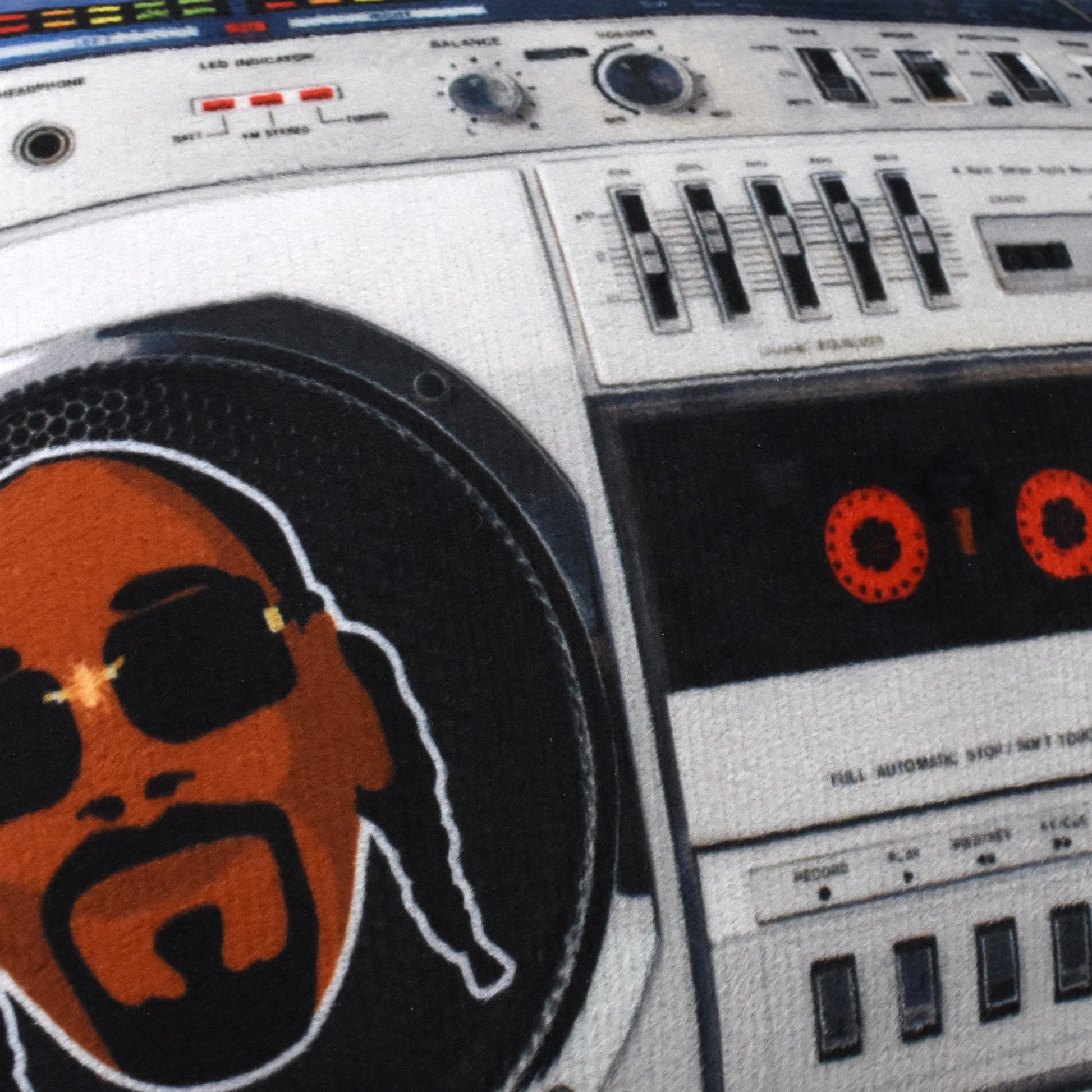 A close up detail image showing the plush fabric of the Deluxe Boom Box Pet Toy.