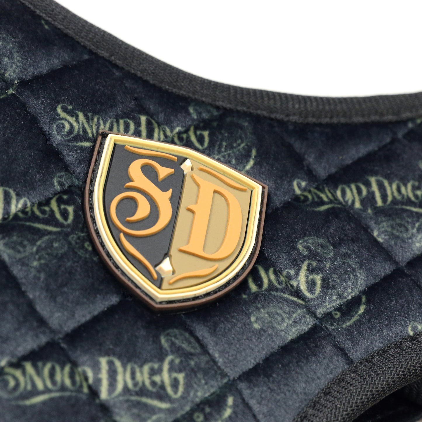 A close up detail image showing the SD Micro Mold Patch and velvet sublimated design on the Deluxe Quilted Pet Harness.
